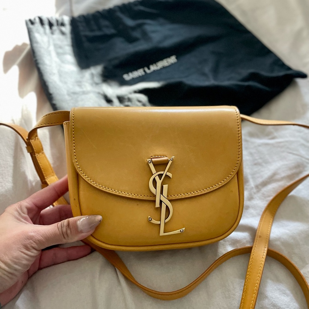 kaia saddle bag by
Saint Laurent crossbody color: mustard yellow